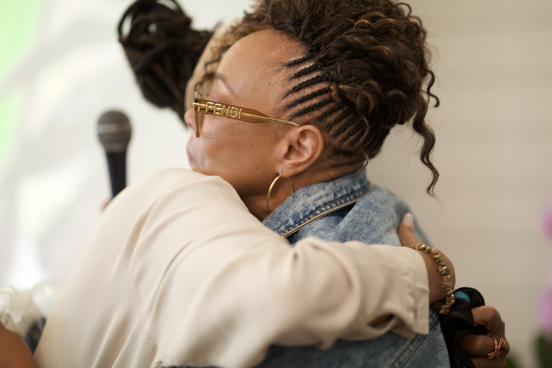 Two women embracing at a past Adam's Purpose gathering